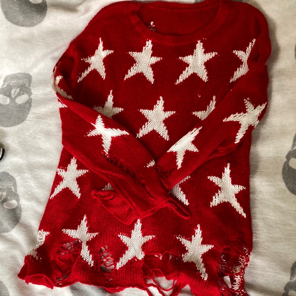 Distressed star sweater
